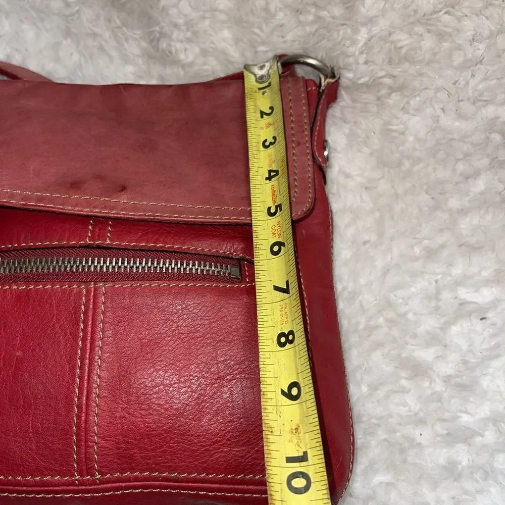 Fossil leather faded red crossbody bag with antique silver tone hardwares.
